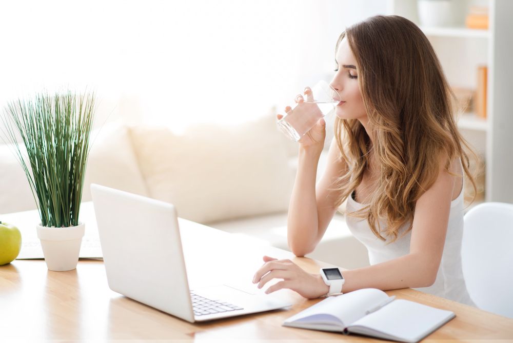 Woman Drinking Water - GurusWay.com