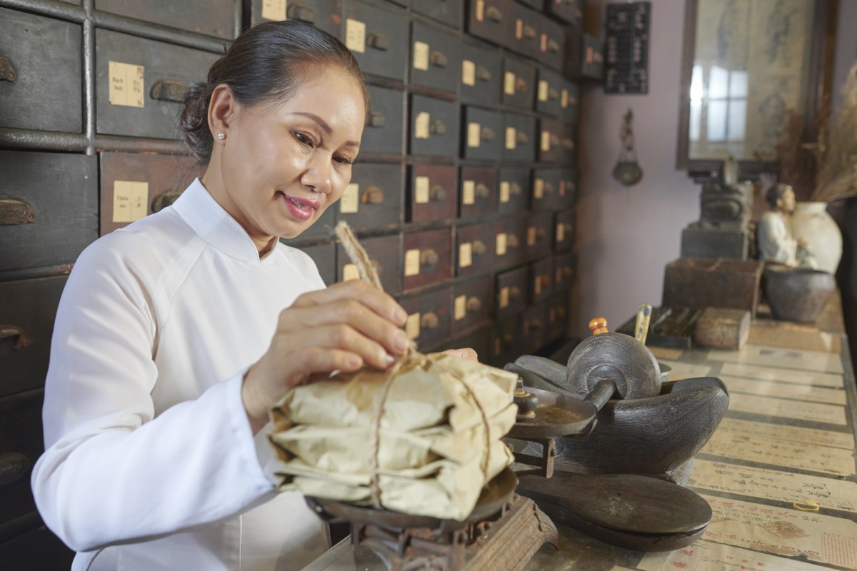 Woman working in TCM store