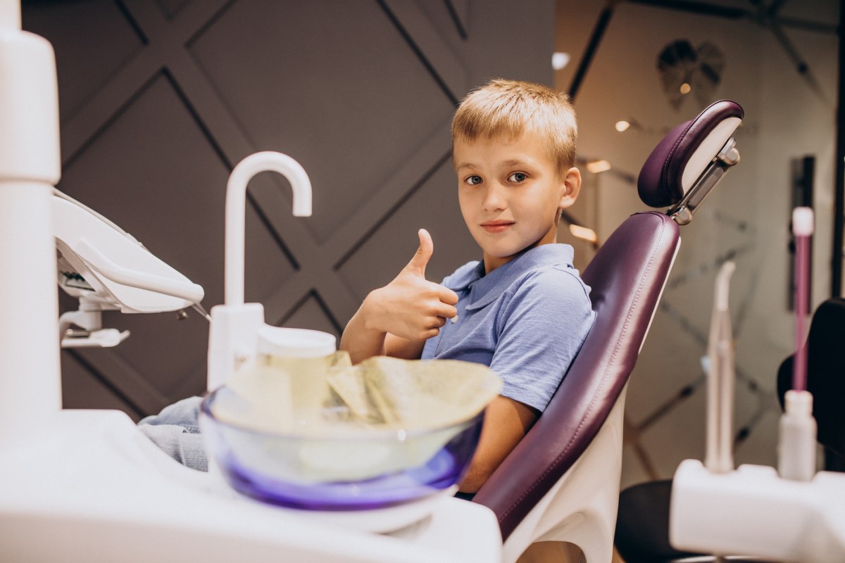 Boy smiling in a dental clinic