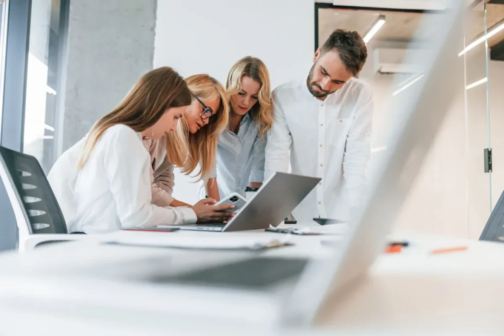 Office team discussing digital marketing vs short term course