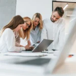 Office team discussing digital marketing vs short term course